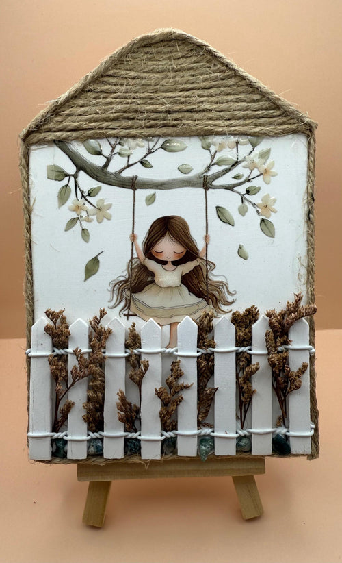 Beeldje meisje op schommel